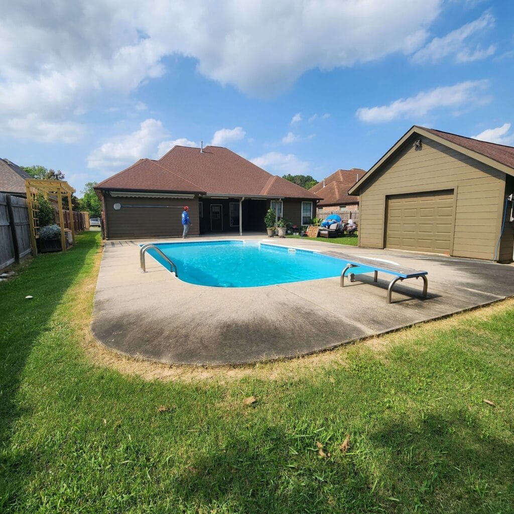 A backyard with a swimming pool surrounded by a concrete deck is featured on the front page. A person in a blue shirt stands near the house in the background. The yard is bordered by a wooden fence and lush grass. A tan garage with a closed door is located to the right of the pool.